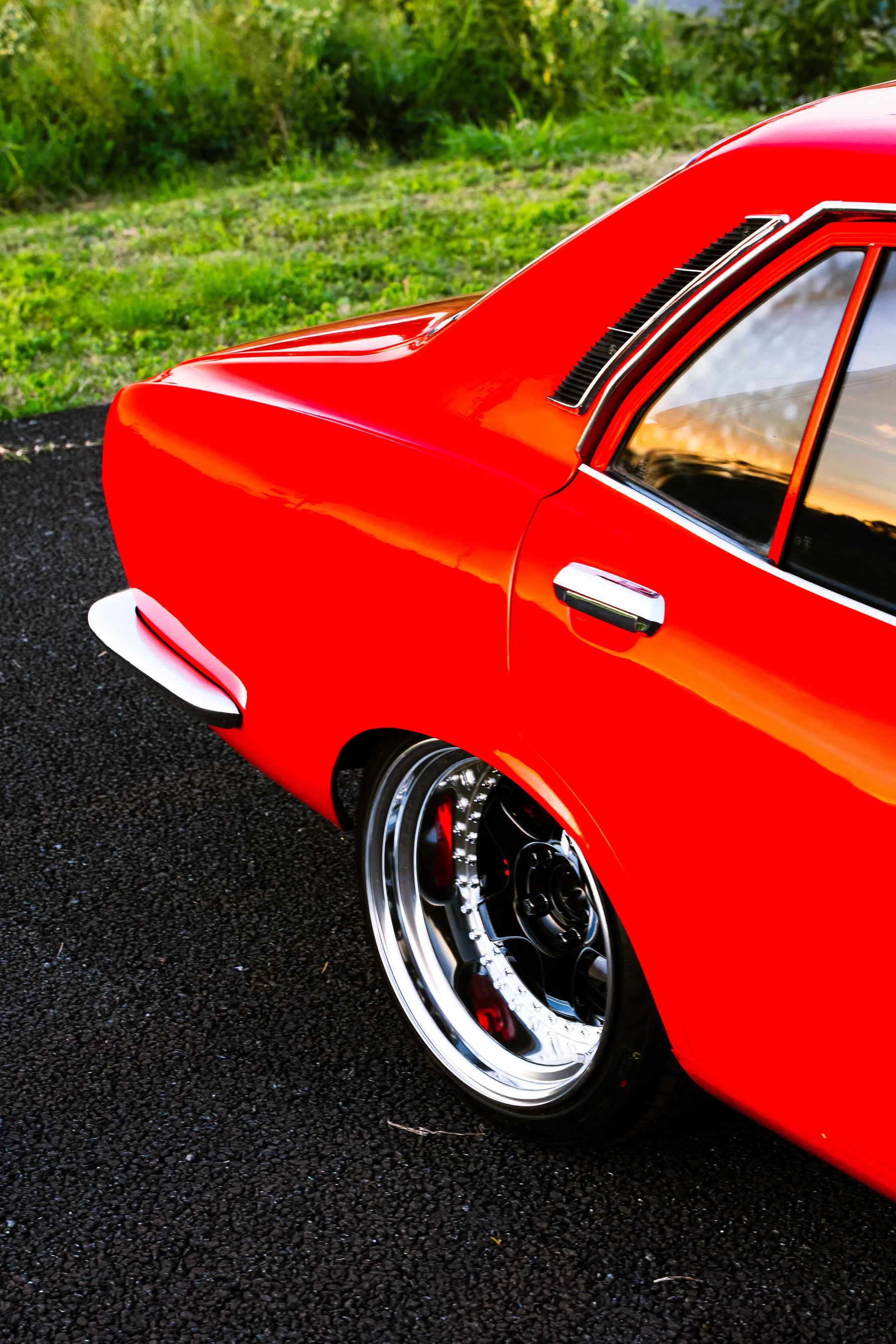 Mazda Capella RX-2 front quarter, slammed stance.